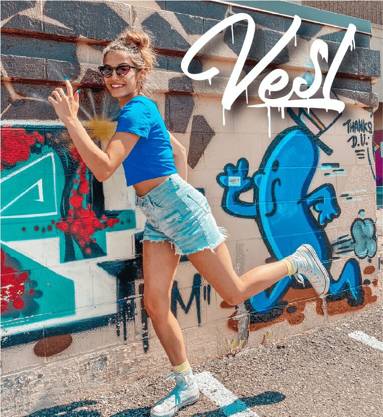 woman blue t-shirt on a graffiti background