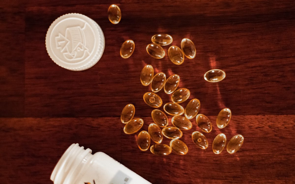 oil capsules and pill bottle, liquid gels