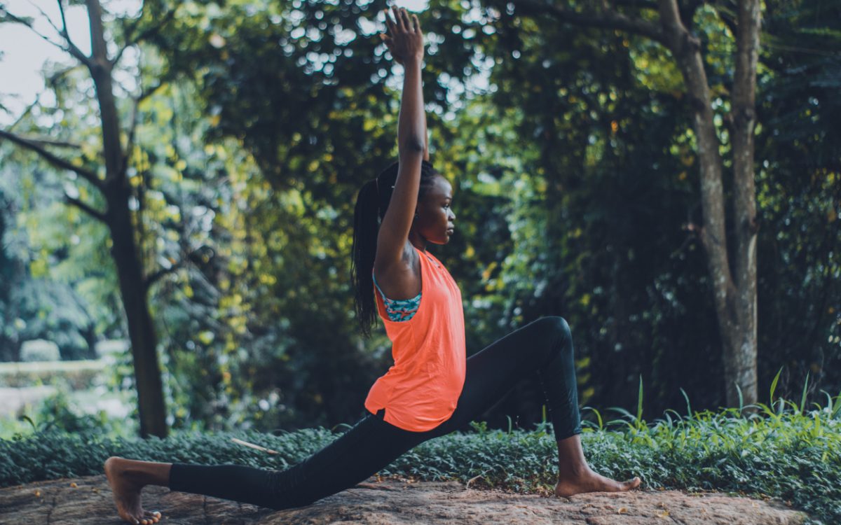 Woman practicing outdoor yoga. Holistic lifestyle