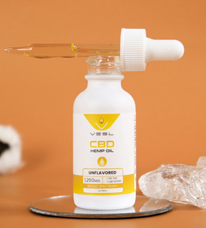 CBD hemp oil dropper bottle natural flavor 1250mg on a display holder
